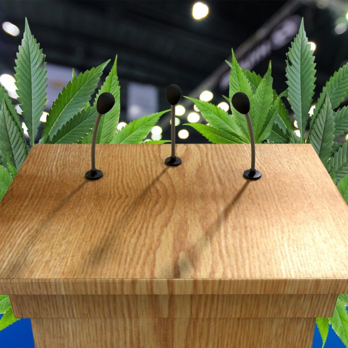 Podium with Cannabis leaves behind it