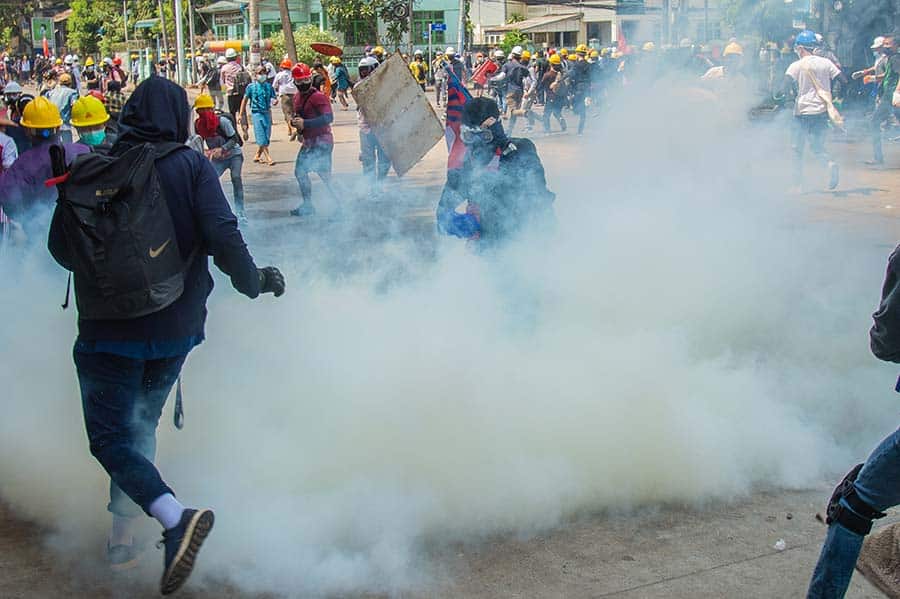 street riot with tear gas