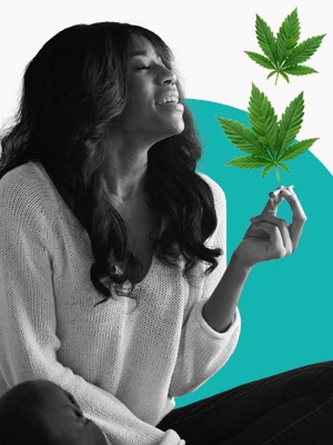 Black woman sitting crossed legged smoking a cannabis joint