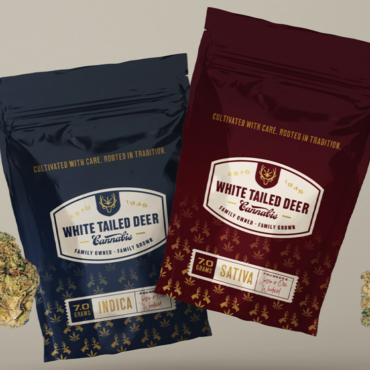 Indica and Sativa cannabis flower bags from White Tailed Deer, featuring heritage-inspired packaging that emphasizes tradition, family ownership, and premium branding.