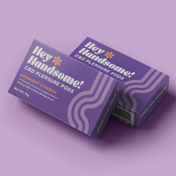 Hey Handsome! CBD Pleasure Pods packaging in bold purple design, promoting Midnight Cowboy rectal lubrication suppositories with CBD isolate for wellness and intimacy branding.