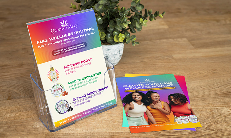 Point-of-sale table display featuring a Queen Mary wellness routine table tent and promotional flyers highlighting daily cannabis wellness products and usage times.